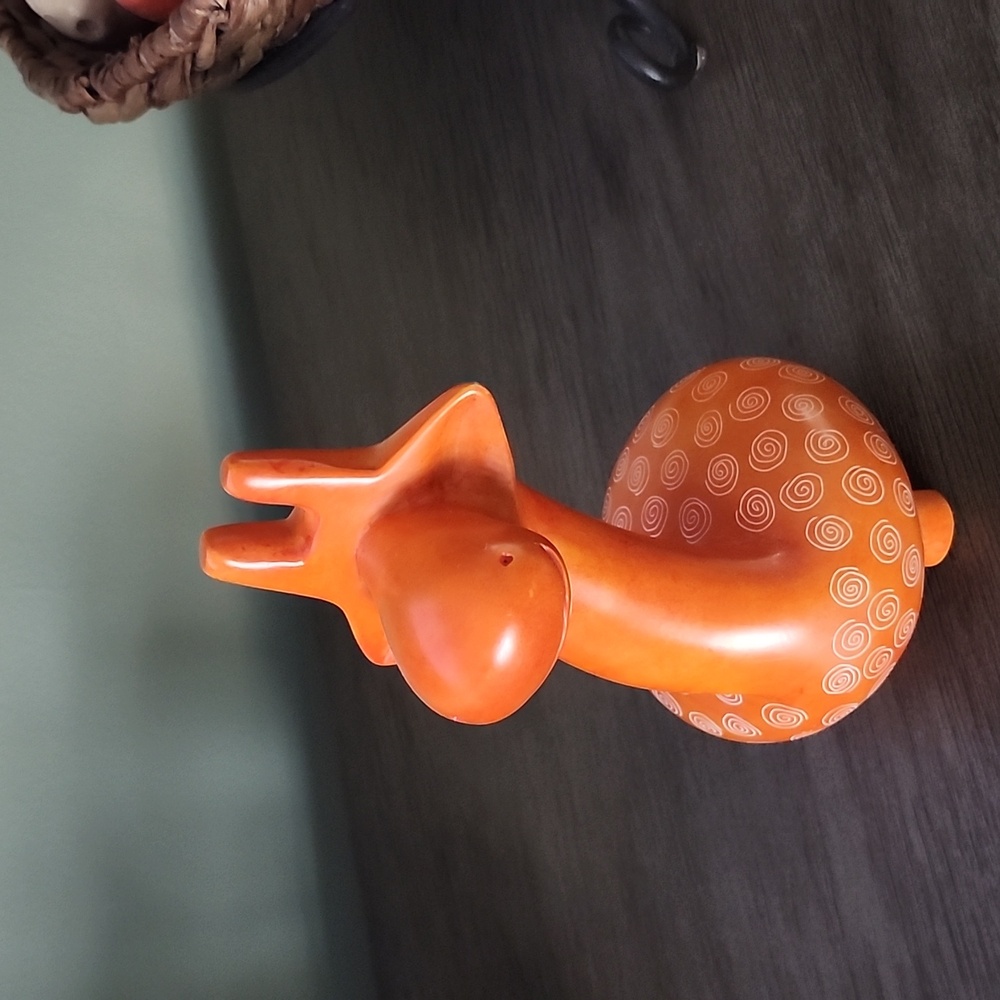 Cute whimsical soapstone giraffe orange.